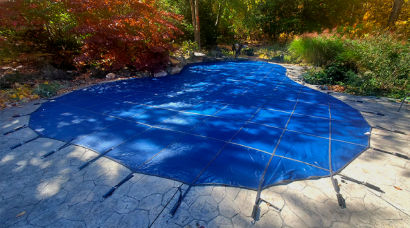 A picture of a blue pool safety cover