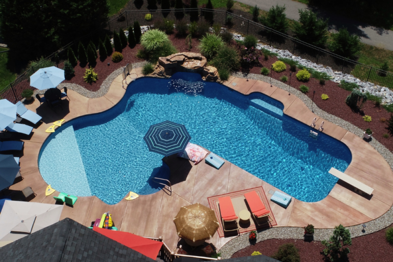 An aerial style picture of a concrete pool